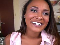 Curved hot ebony smiles while she sucks and licks a big cock